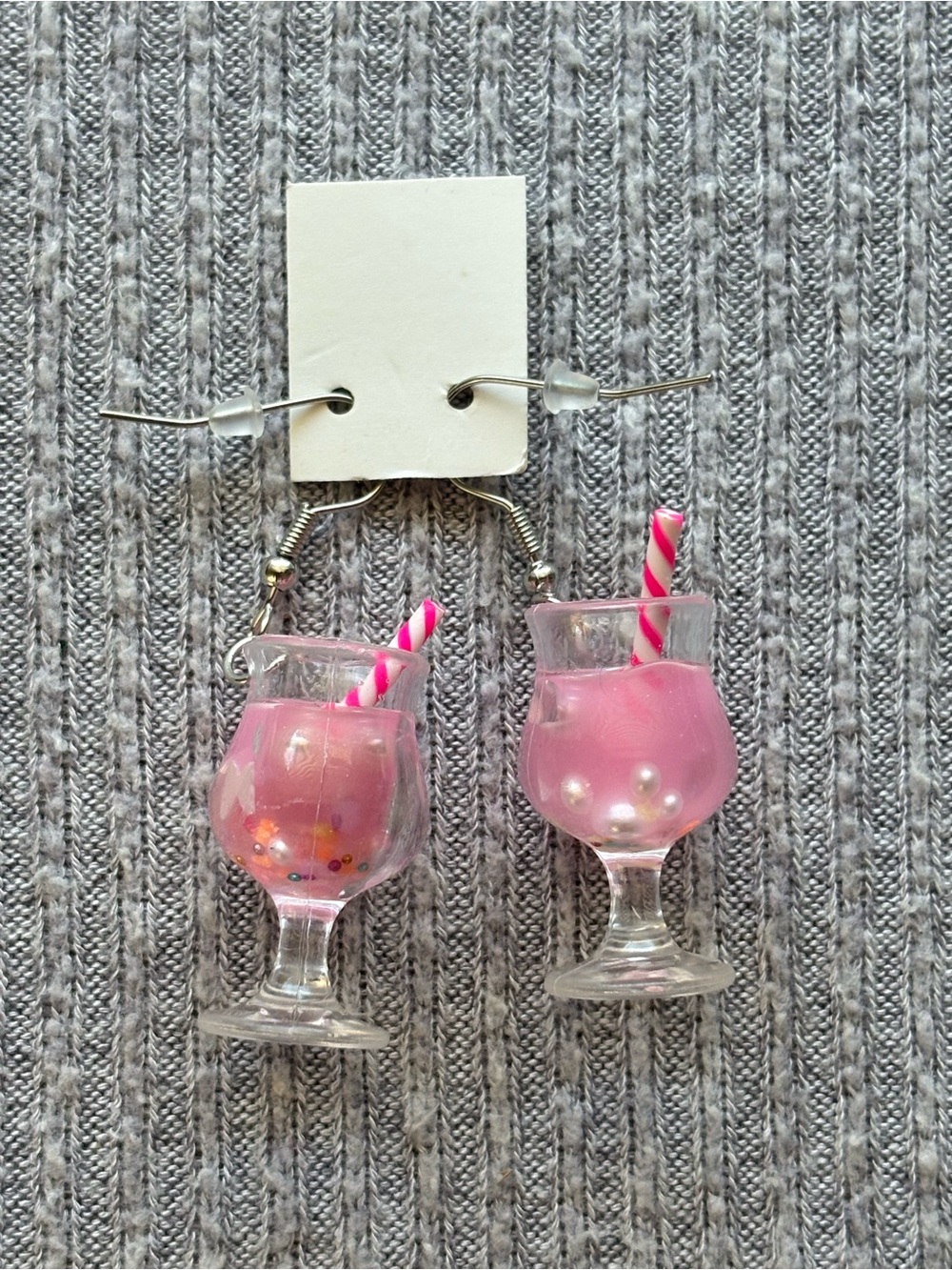 Y2K theme pink cocktail with straw dangly earrings